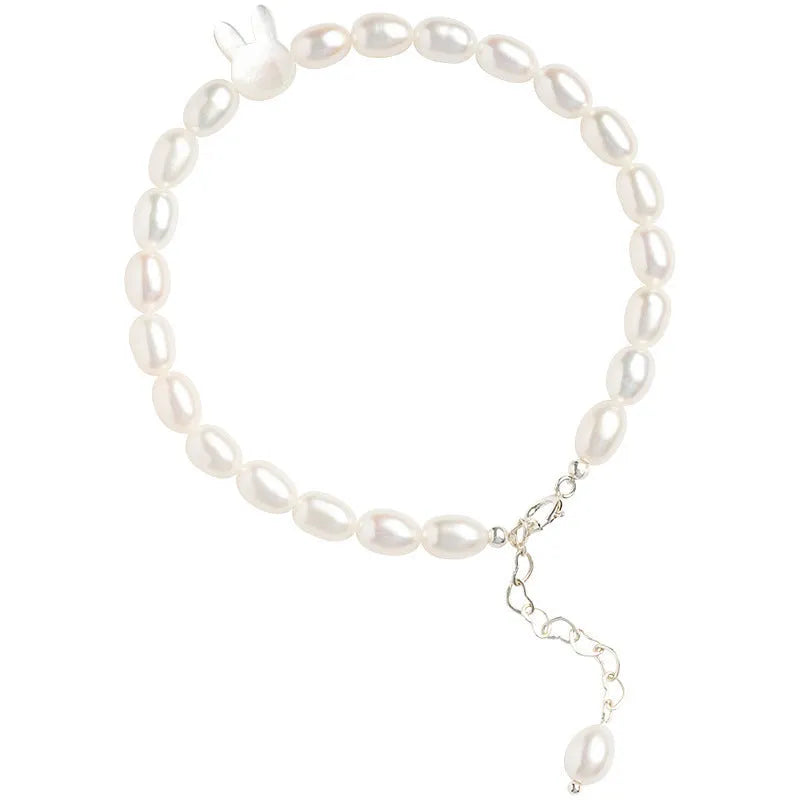 White pearl bead bracelet with 925 silver rabbit charm on elastic string