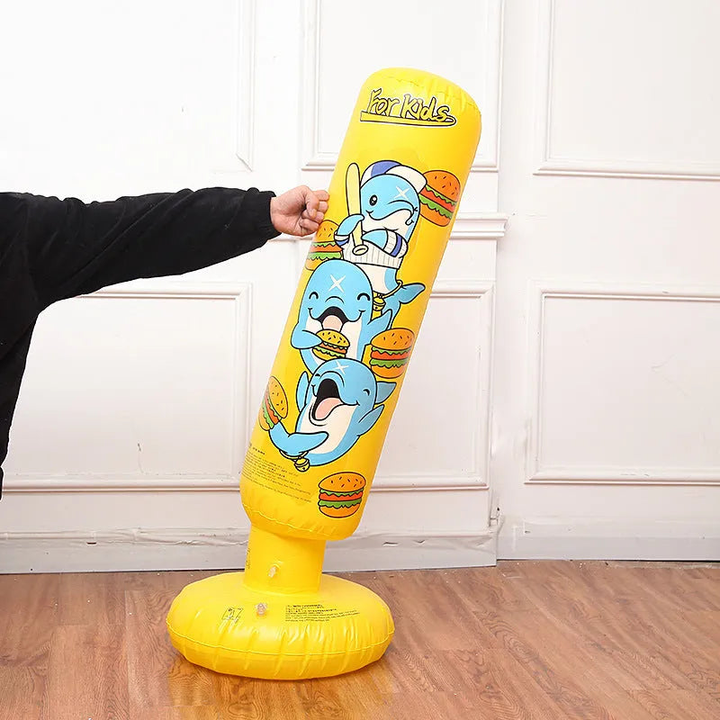 Tall yellow inflatable boxing column standing upright on a floor.