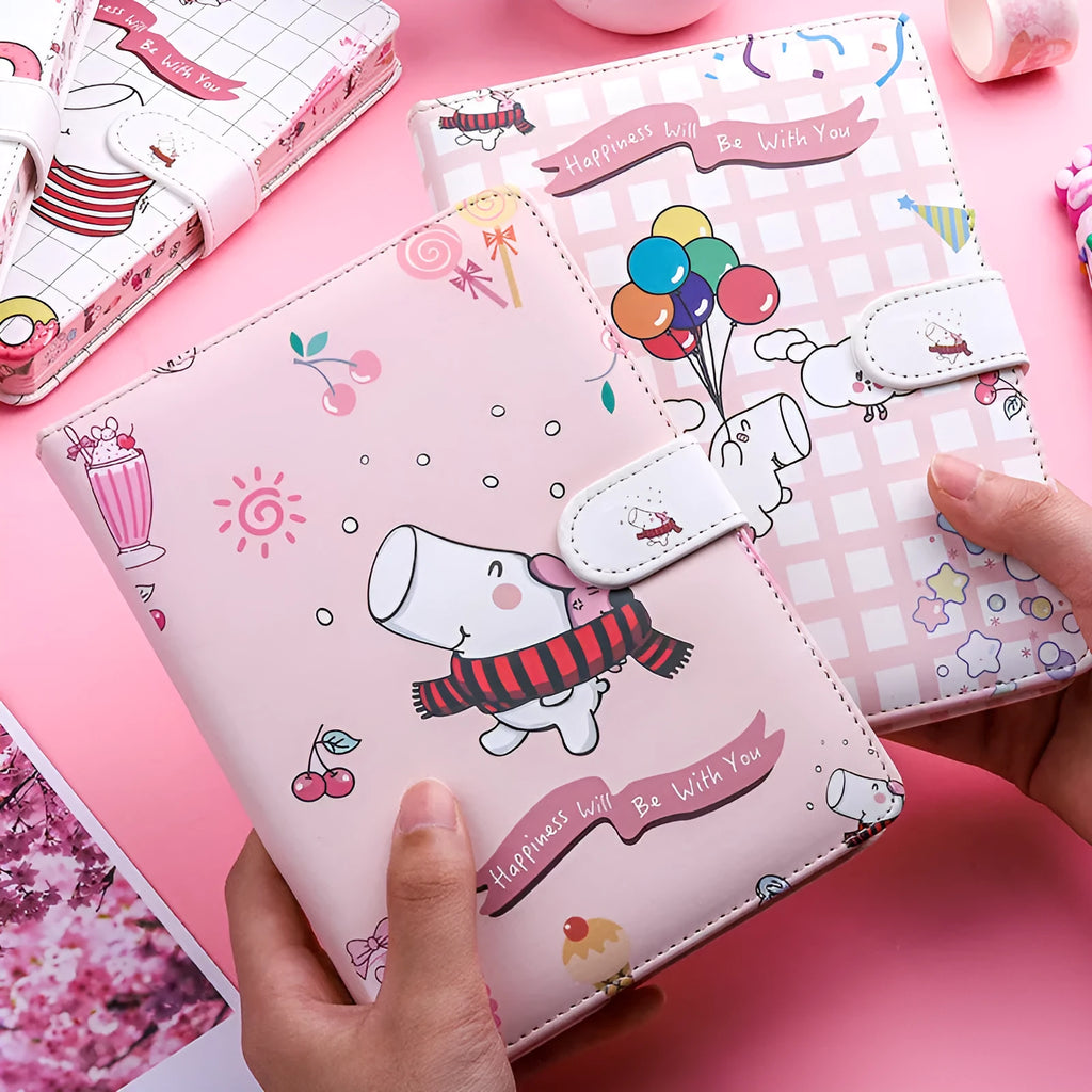 White Kaba Bear Hippo A6 notebook with magnetic buckle and heart design, showing size next to a pen.