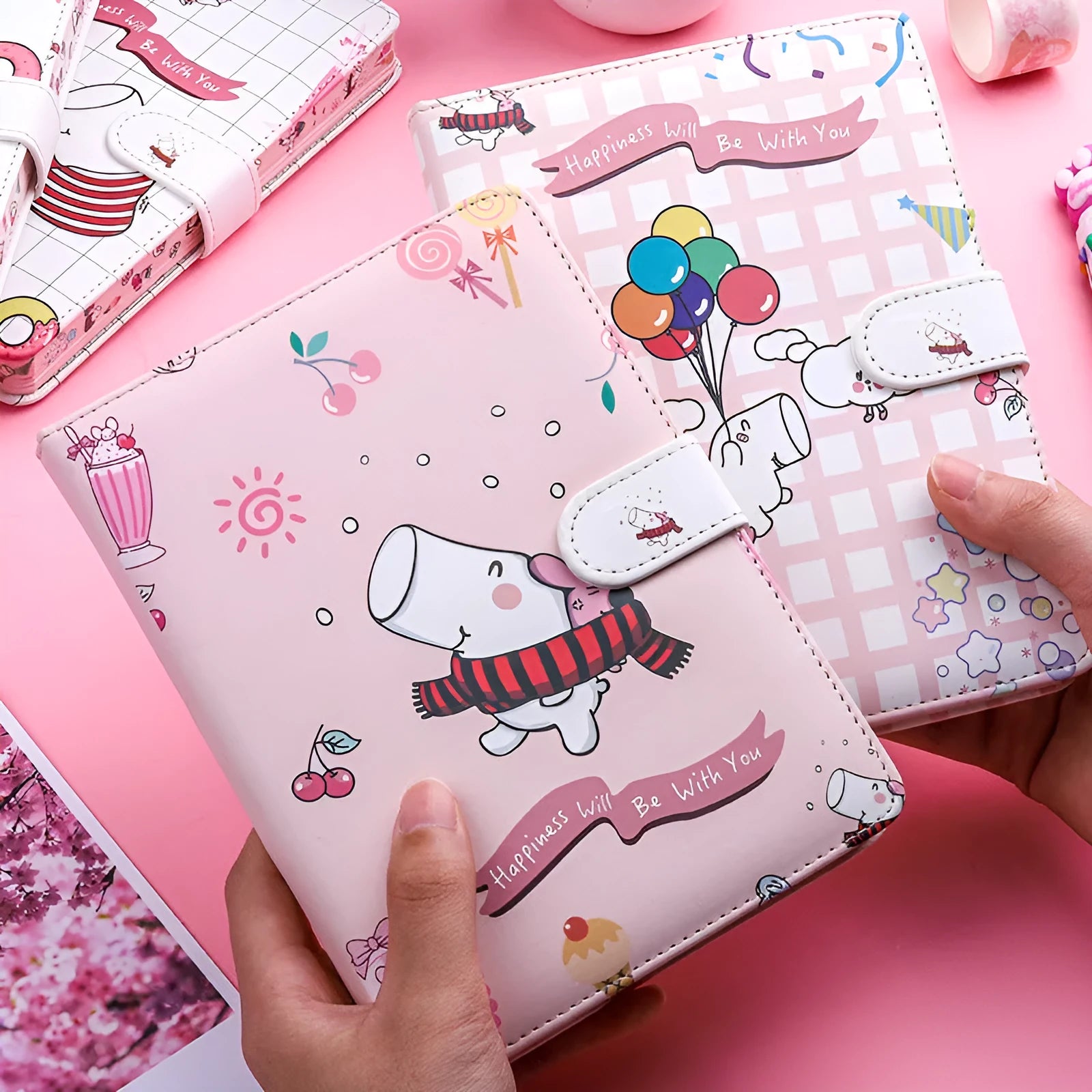 White Kaba Bear Hippo A6 notebook with magnetic buckle and heart design, showing size next to a pen.