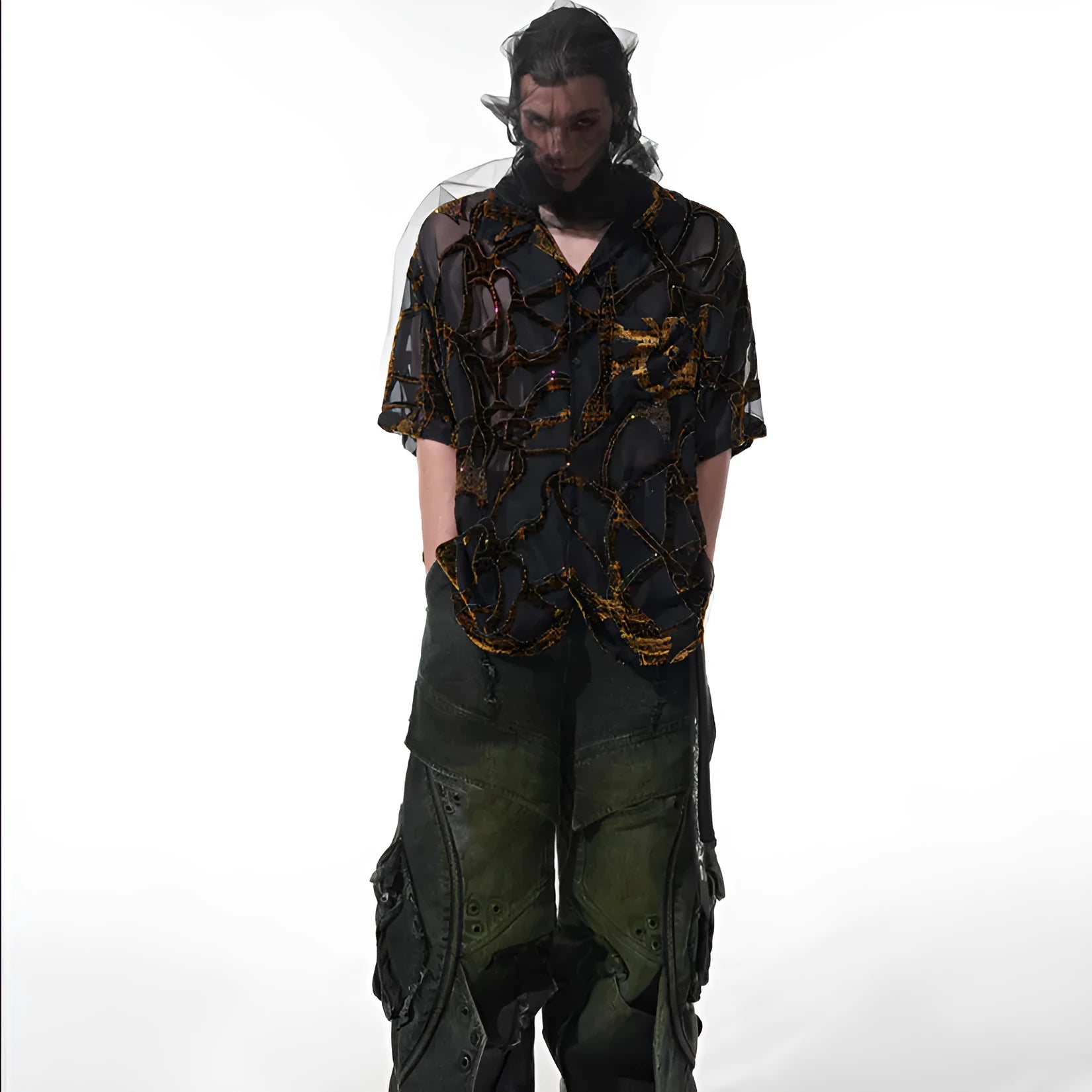Man wearing a black and grey snake pattern short-sleeved translucent polyester shirt with a loose fit.