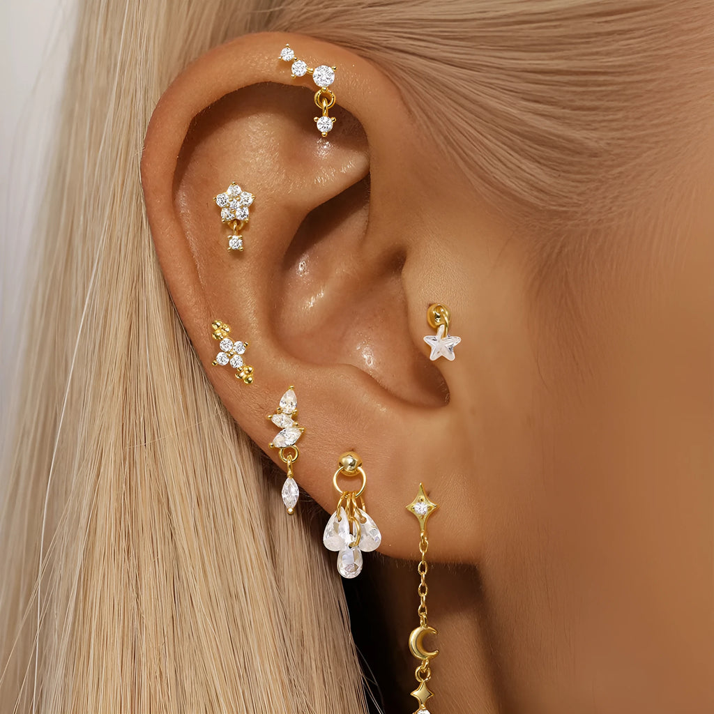 S925 sterling silver geometric earrings with a moon and embedded diamond star design in a gold-toned finish.