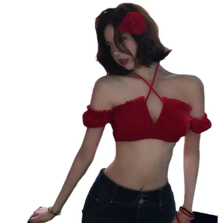 Red women's bikini swimsuit with puff sleeve top and solid briefs laid flat