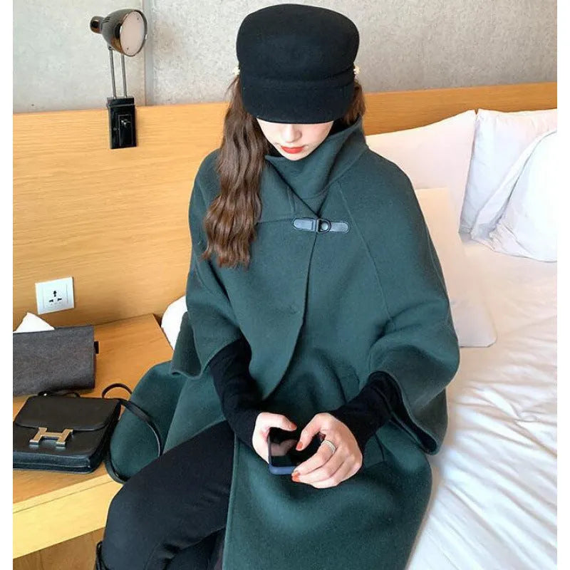Korean-style women's long coat in oatmeal colour with flight sleeves, shown on a model.