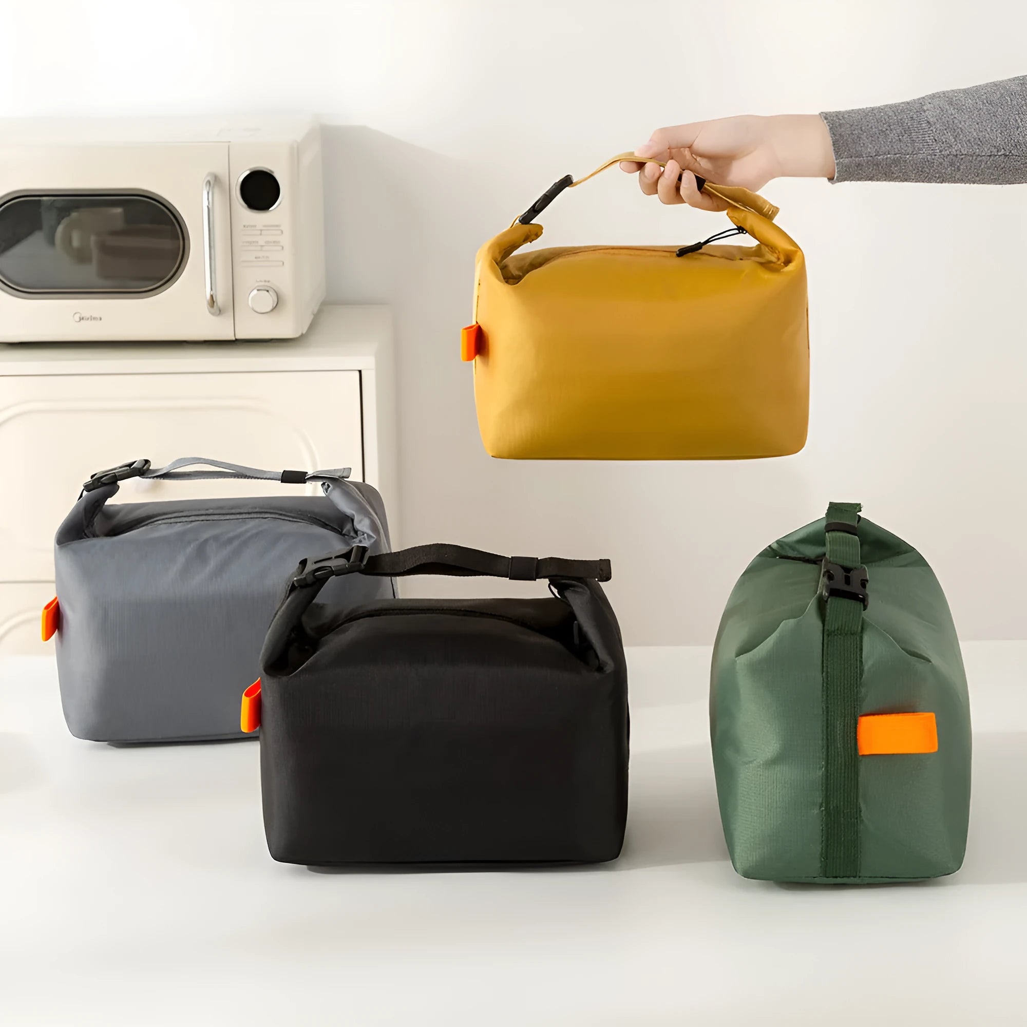 Japanese-style insulated lunch bag in Oxford cloth, shown open with a lunch box inside.