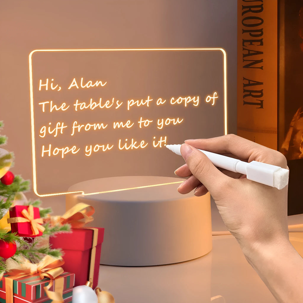 Heart-shaped LED light note board with USB warm yellow glow, base, and pen on a desk