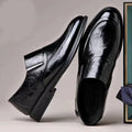 Business formal slip-on shoes with pointed toe, PU upper, rubber sole, and decorative metal and embossed details