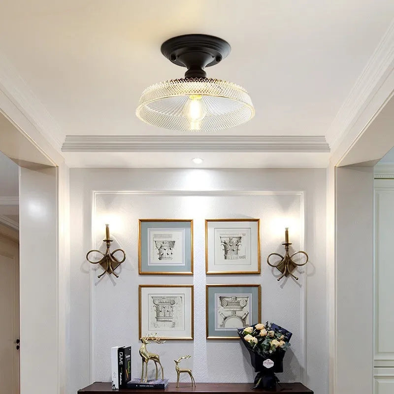 American retro style single-head ceiling or wall lamp with a glass cover.