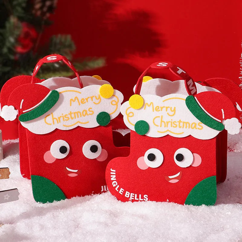 Green felt gift bag with cartoon Christmas design on a white background