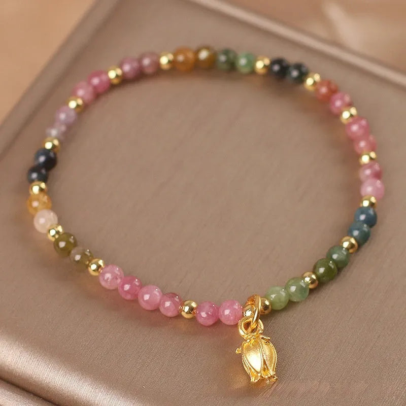 Natural tourmaline beaded anklet with flower-shaped stones on a delicate chain for women