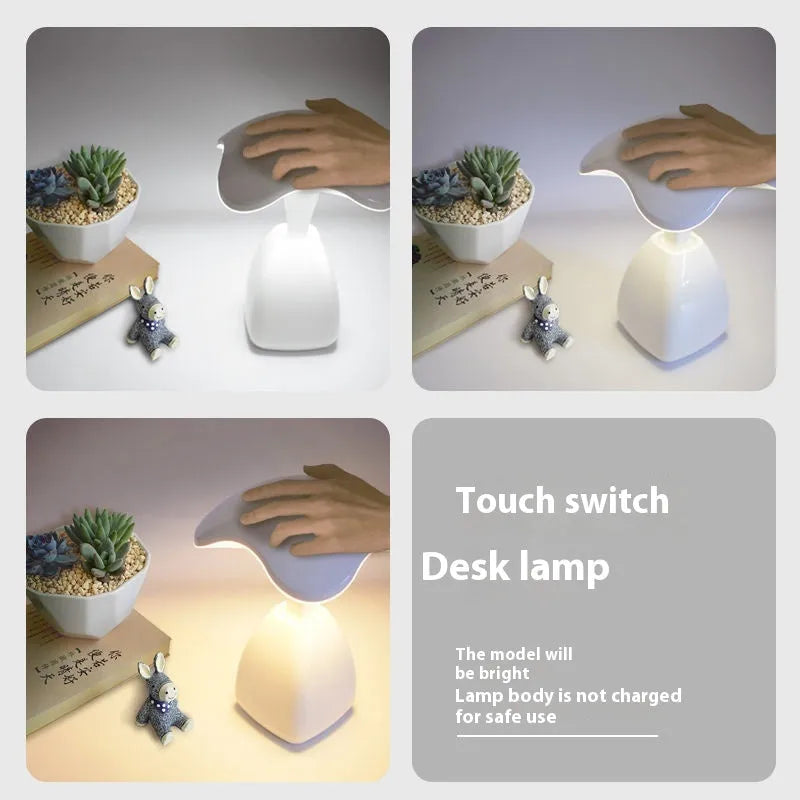 White modern LED desk lamp with plastic shade and touch controls on wooden desk