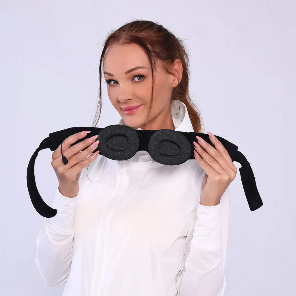 Grey outline Bluetooth sleeping eye mask with adjustable head strap on neutral background