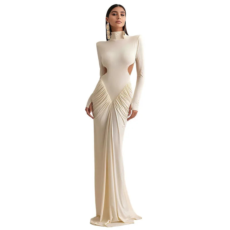 Women's slim fit long sleeve dress with high collar and pleated backless detail in apricot colour.