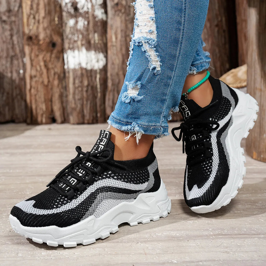 Women's lightweight casual sports shoe with mesh upper, PVC sole, and front lace-up in Black White colour