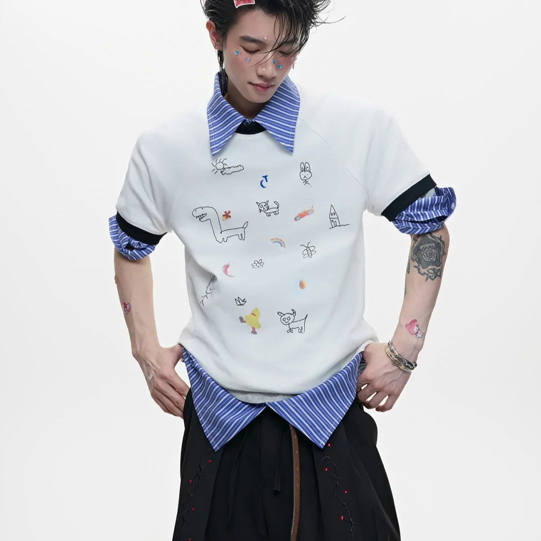 Man wearing a loose fit blue short sleeve shirt with a large cartoon graphic print on the front.