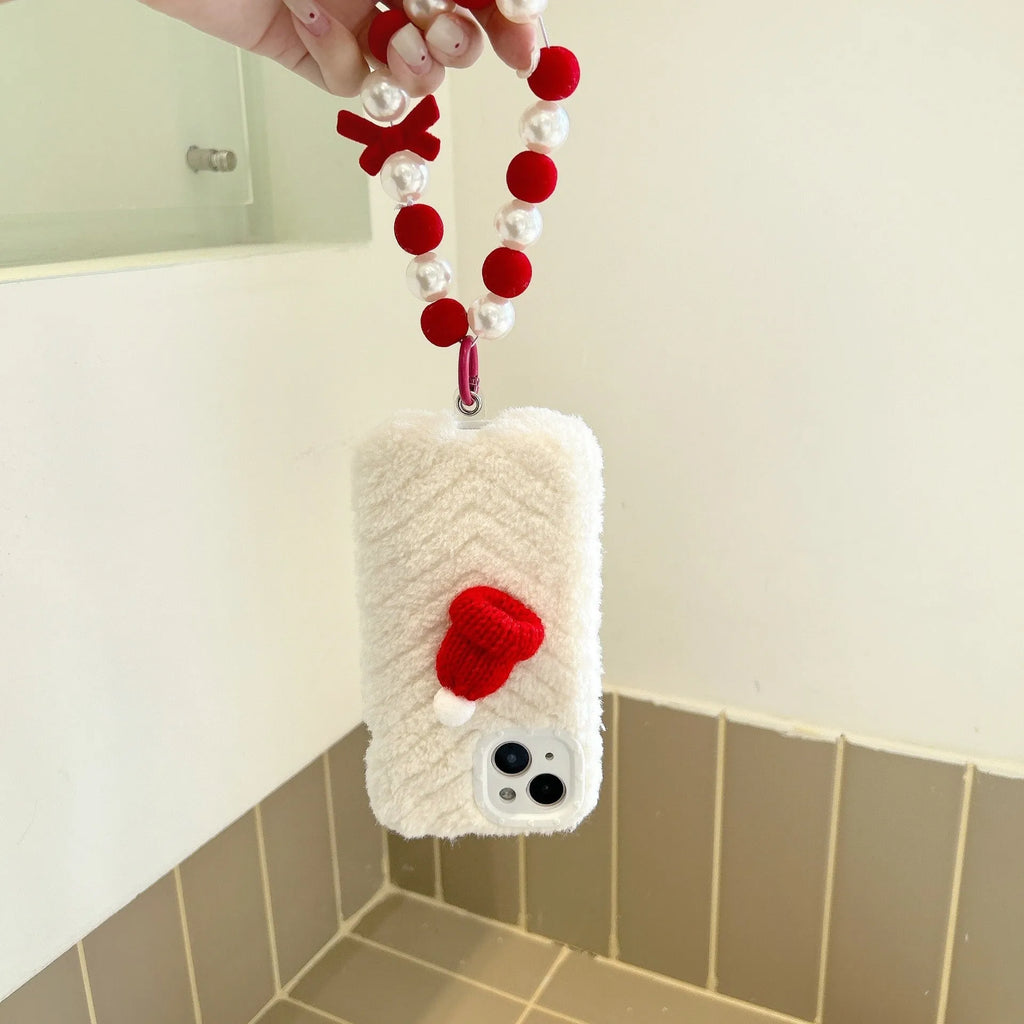 Red silicone phone case with plush Christmas hat bracelet for iPhone on white background