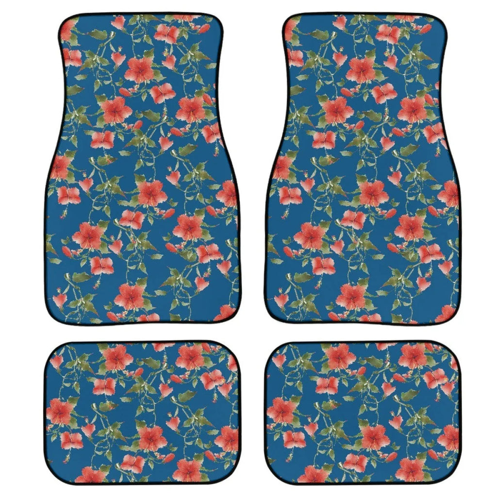 Black four-piece rubber car foot mat set with textured surface, shown on a car floor.