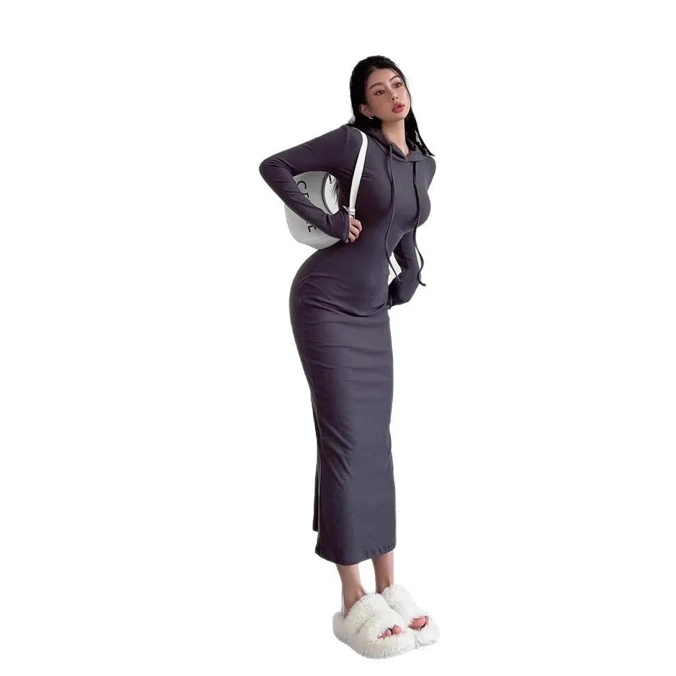 A light grey women's hooded sheath dress with long sleeves and a high waist on a model.