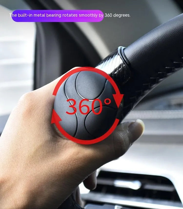 Black and blue steering wheel assist balls showing silicone cover and approximate 9cm by 6cm size