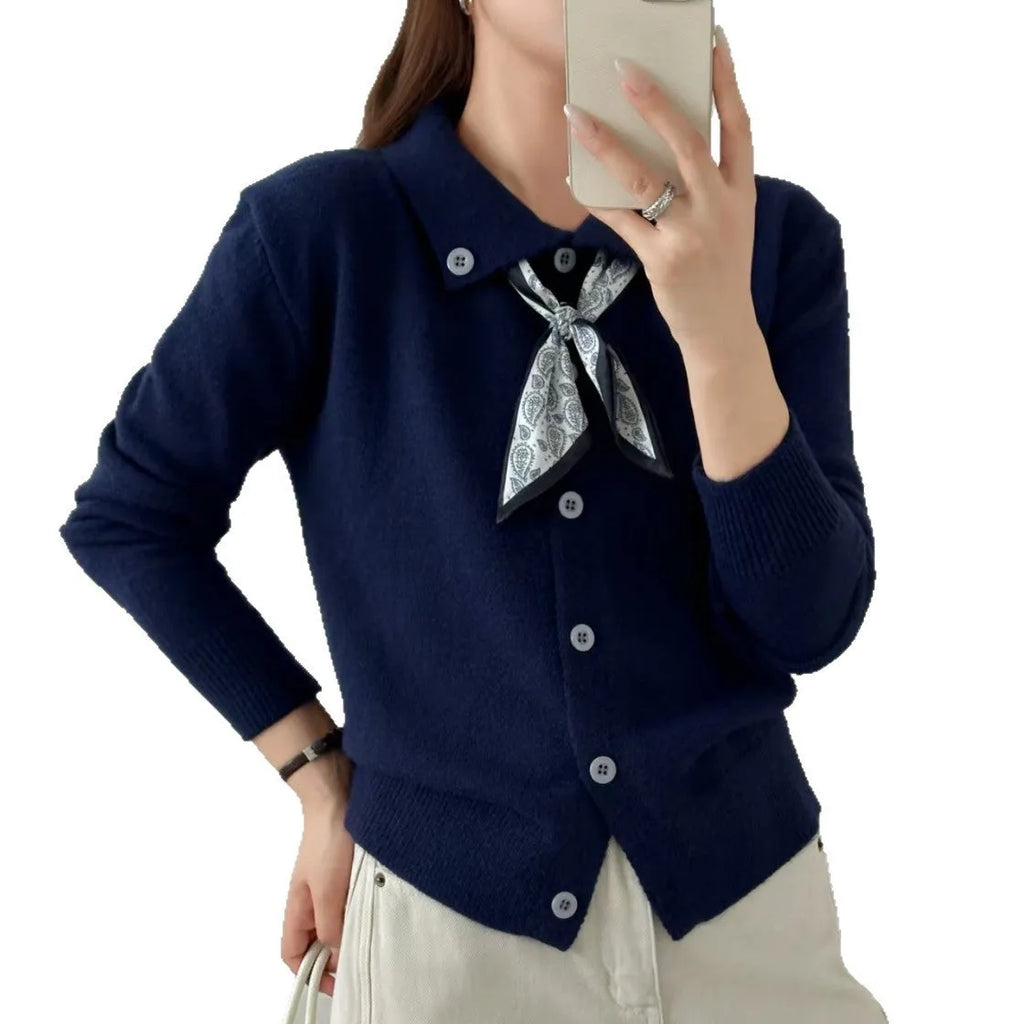 Beige lapel scarf style acrylic cardigan sweater with long sleeves and splicing detail.