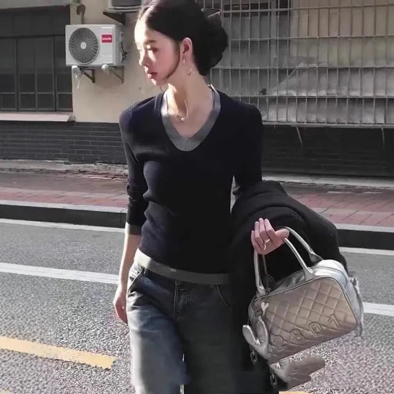 Black Korean style fake two-piece V-neck knitted pullover top on a woman
