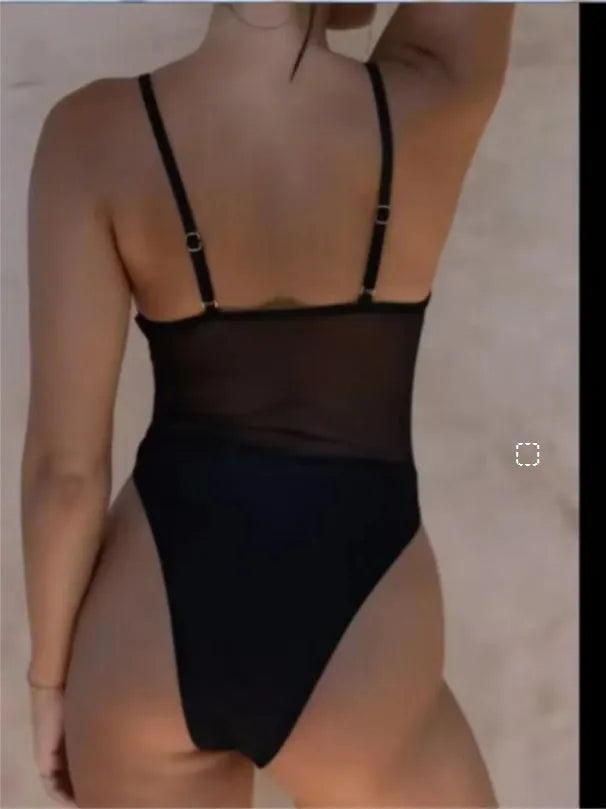 Ladies black and yellow one-piece swimsuit with banded design on a mannequin.