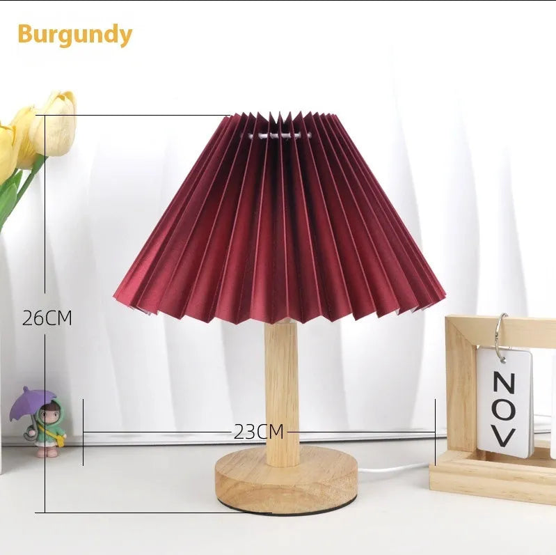 Vintage pleated umbrella-shaped bedside lamp with remote control on bedside table