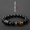 Handcrafted obsidian bracelet with 10mm yellow tiger eye beads on elastic cord