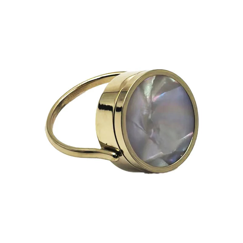 Gold electroplated titanium steel unisex storage ring with future-style round design on a plain background