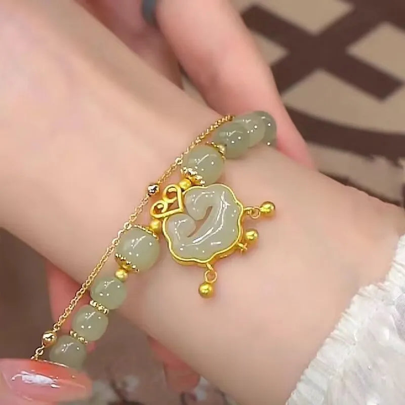 Women's green double-layer bracelet with safety lock pendant in drop shape design