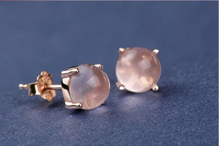 Rose gold drop shape stud earrings with synthetic Ross quartz crystal inlay