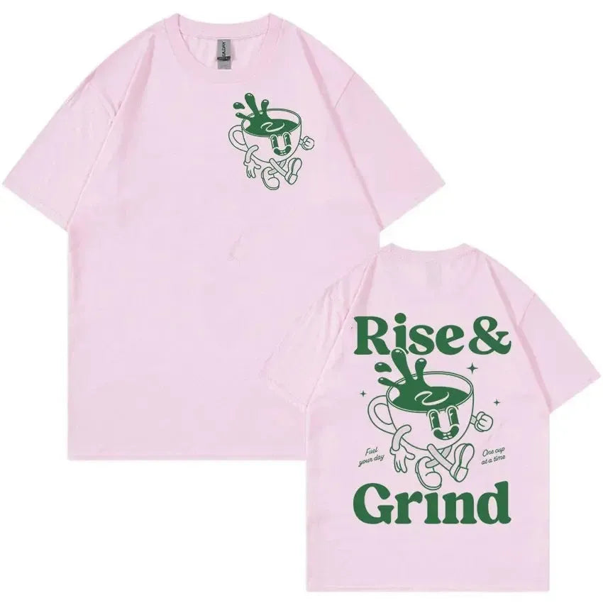Man wearing a loose black linen t-shirt with a green 'Rise And Grind Green Coffee' cartoon graphic print.