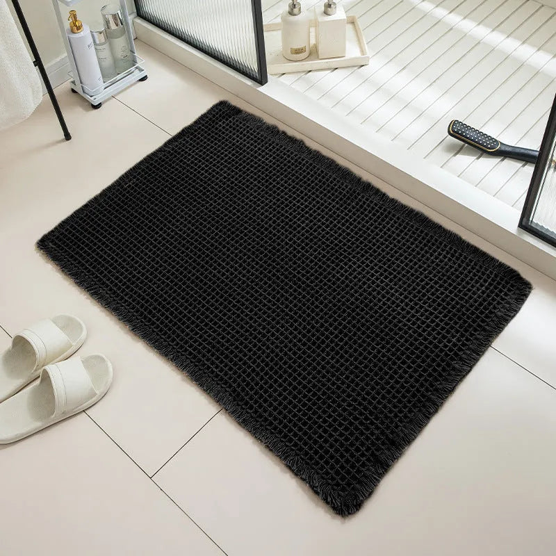 Checkered pattern non-slip absorbent bathroom floor carpet in beige colour.