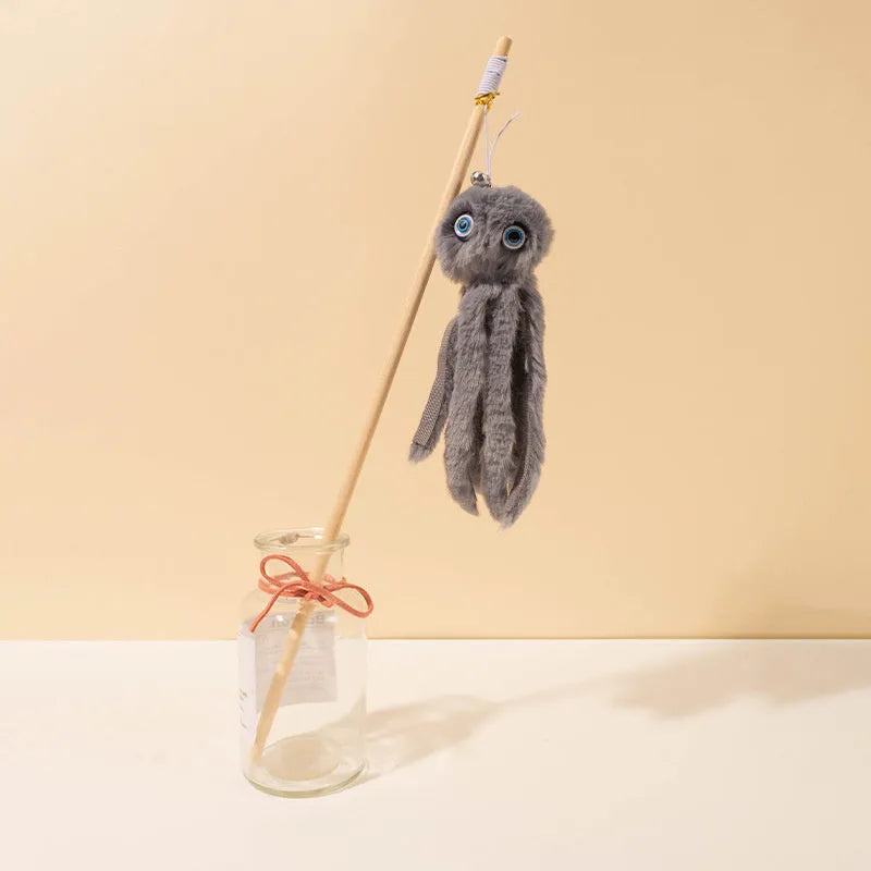 Octopus design cat toy with movable eyes on a long stick, shown in grey, pink, purple, or red.
