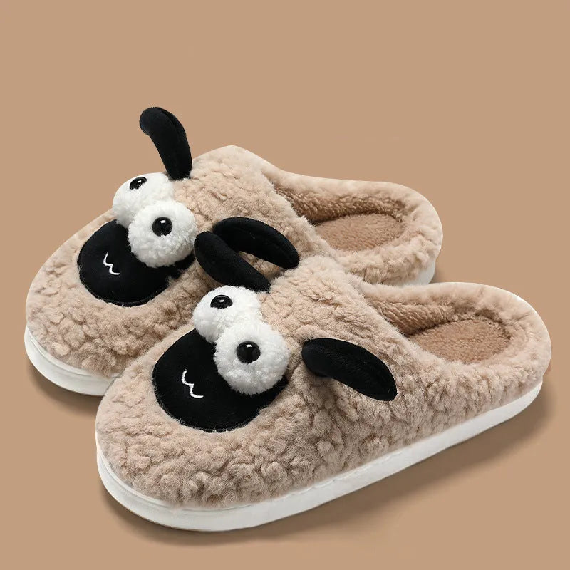Brown lamb thermal cotton slip-on slippers with suede upper on a wooden floor.