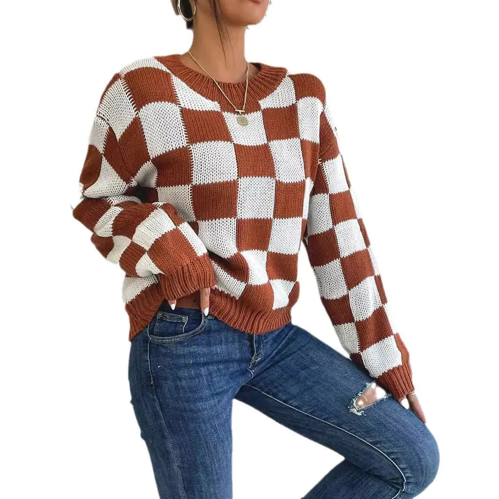Dark brown plaid pattern long sleeve pullover sweater on a hanger.