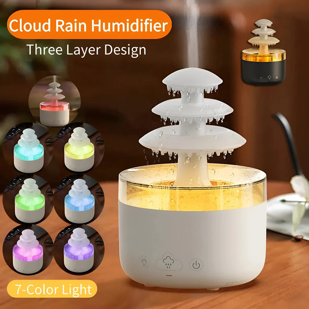 White cloud rain shape ultrasonic humidifier and essential oil diffuser with colourful LED lights on a table.