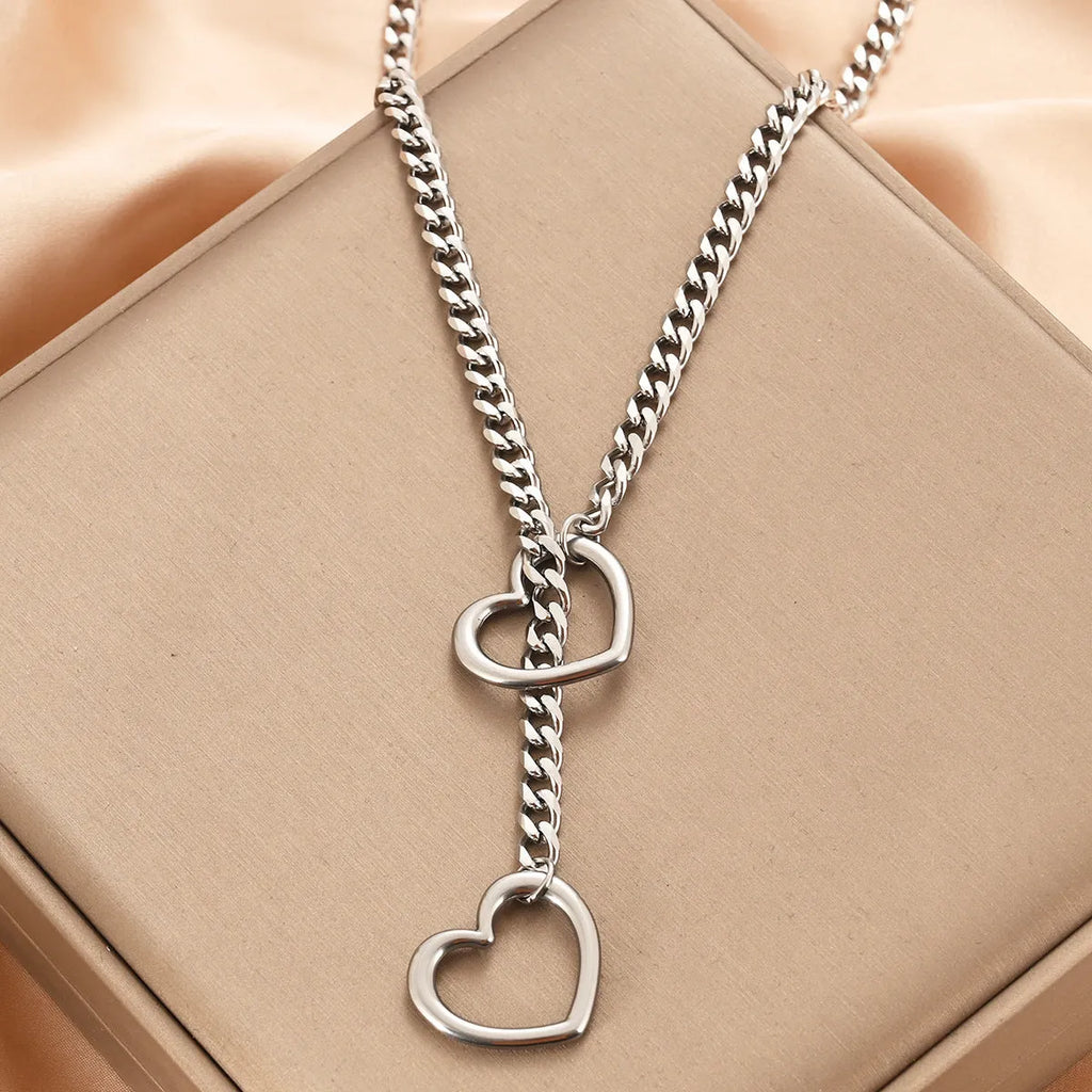 Stainless steel lariat heart necklace with long regular chain in steel, gun black, or gold