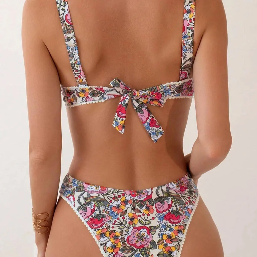 Women's floral print bikini with steel bracket push-up and tied sides, shown in high-waist briefs style.