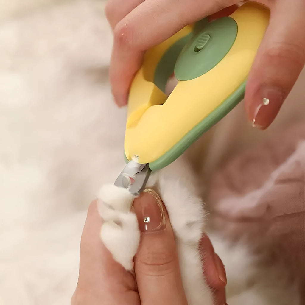 Green pet nail clipper with LED light on, safety guard, and stainless steel blades for small dogs and cats.