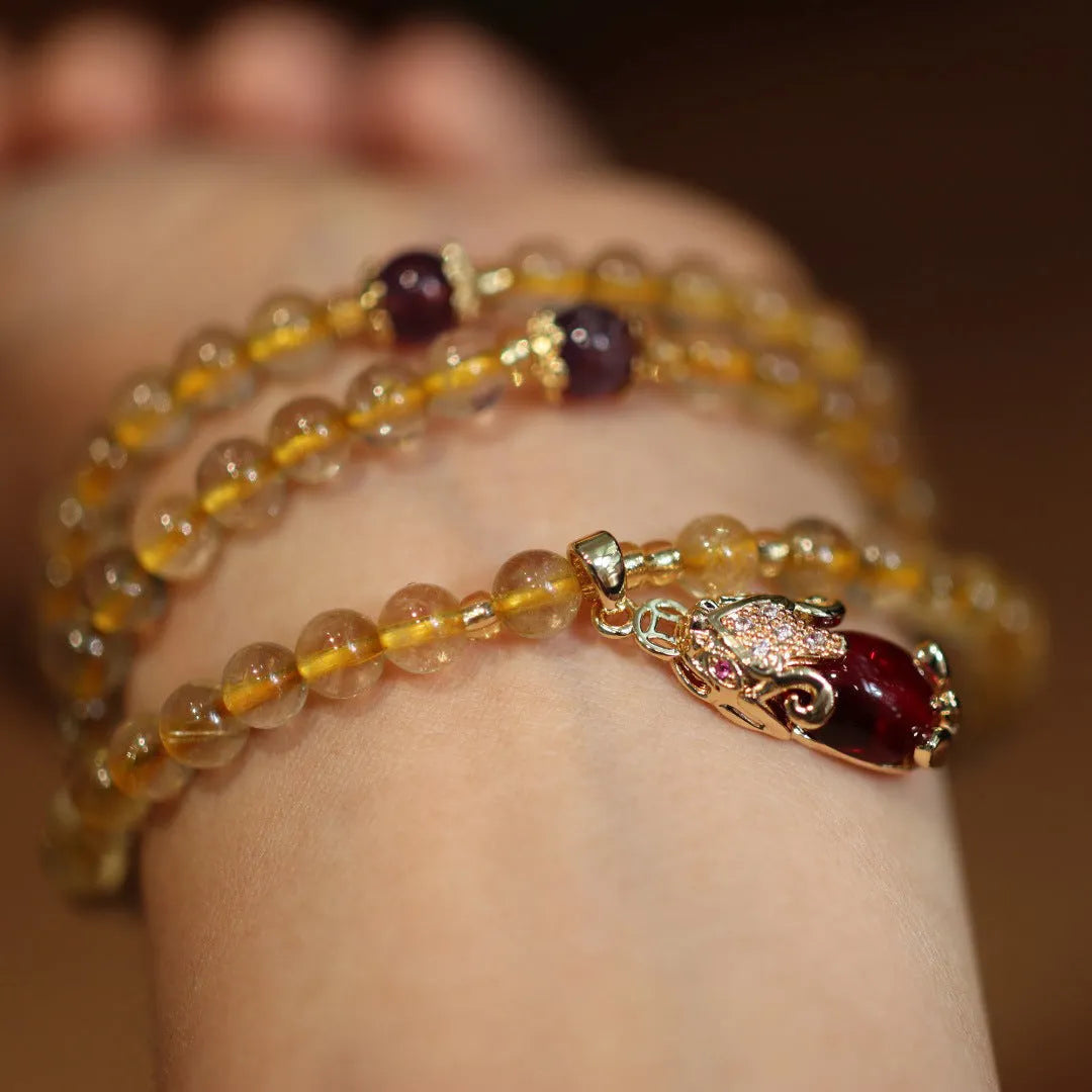 Natural Brazilian gold rutilated quartz bracelet with three gold beads and hanging chopsticks ornament
