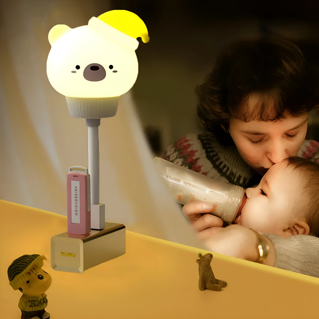 Cute cartoon animal USB night light in bear shape with soft white glow on a bedside table.
