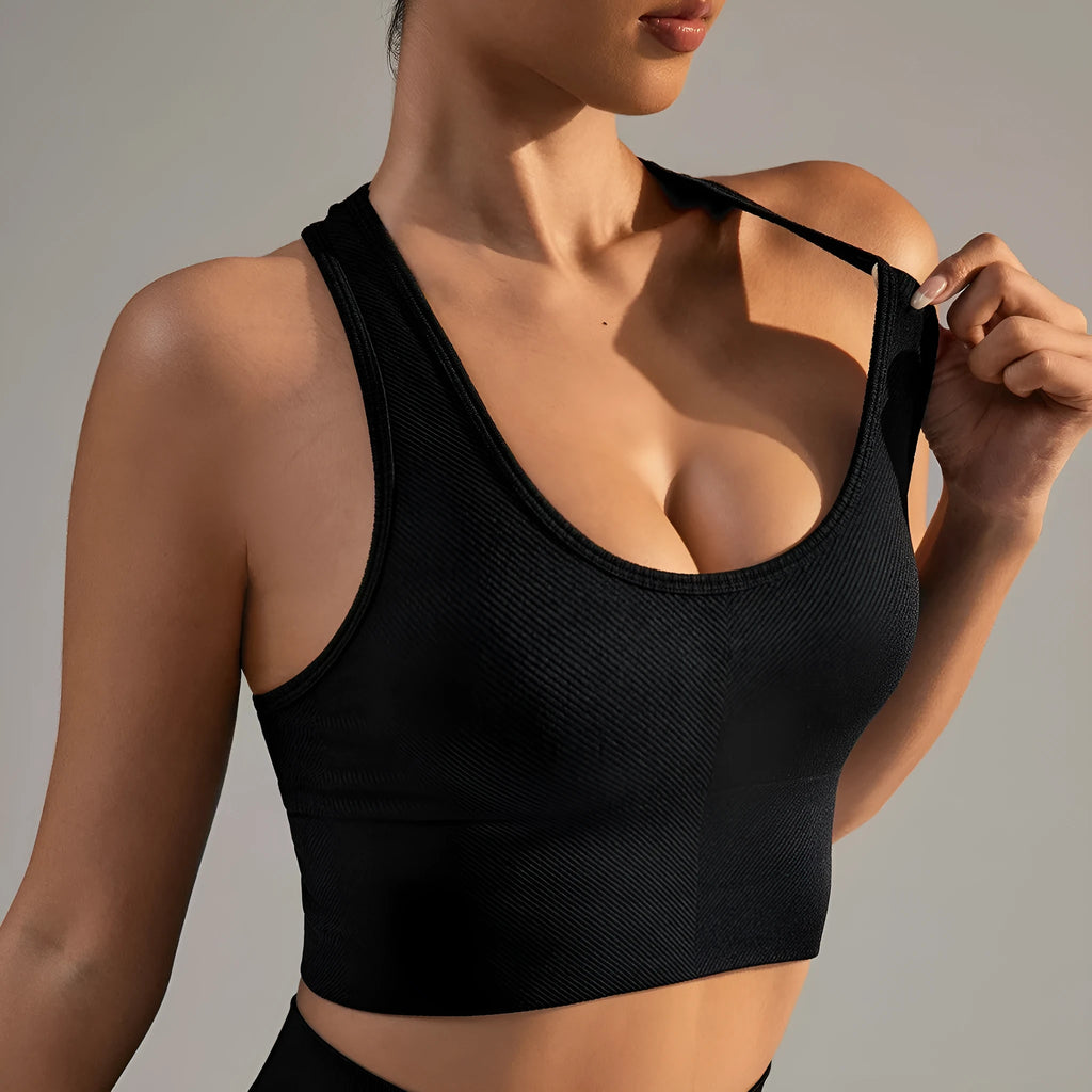 Black cross-back sports bra with quick-dry nylon fabric for running and yoga support