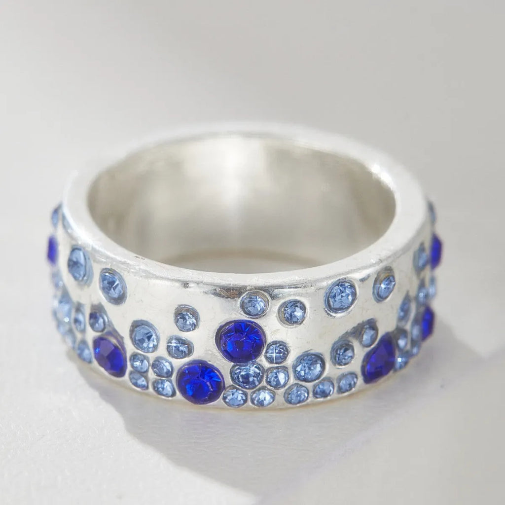Mixed colour diamond retro personality ring in unisex geometric style on a white background.