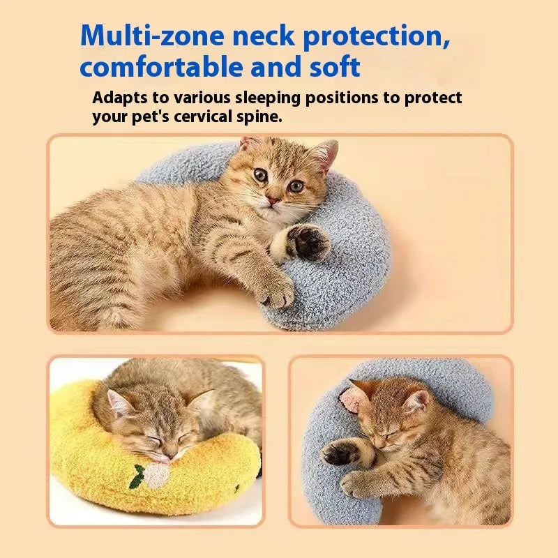 Blue U-shaped cat sleeping mat with integrated moon-shaped neck pillow on a wooden floor.