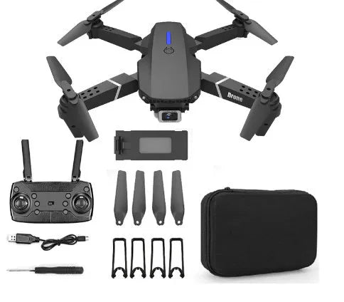 Grey foldable 4K dual camera drone with remote controller on a table.