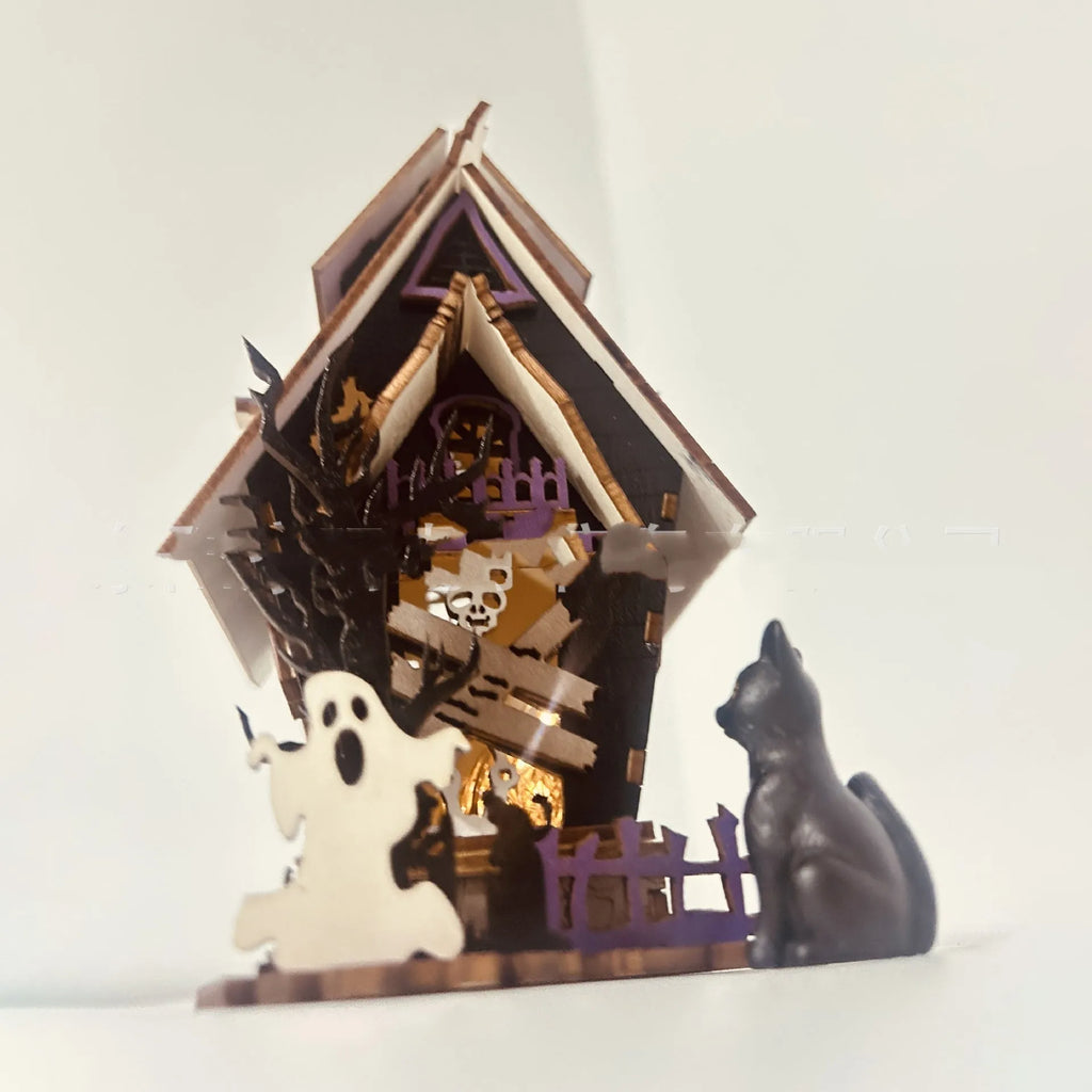 DIY wooden glowing haunted house Halloween table decoration and candlestick holder.