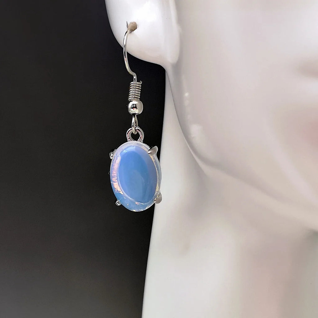 Women's opal earrings with cross pendant in drop shape and moonlight opal colour