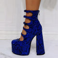 Women's black waterproof platform high heels with a thick heel, serpentine belt buckle, and patent leather upper.