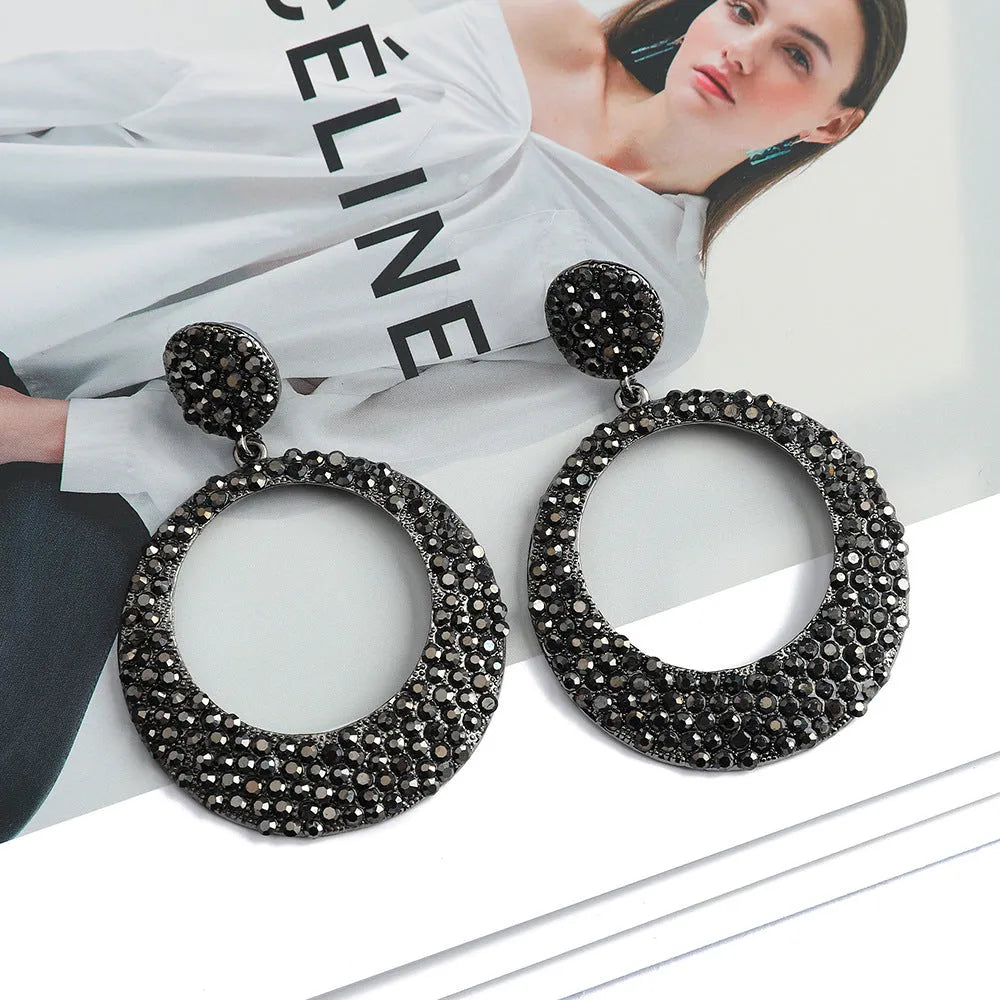A pair of large colourful alloy pendant earrings with a diamond-shaped round cartoon design.